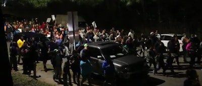 Hundreds gathered in streets of a Raleigh neighborhood Monday night to protest a fatal police shooting. (Photo: Screen shot from News & Observer video)