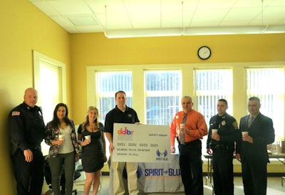 Chief William Smith (center right) accepted the Spirit of Blue safety grant on behalf of the officers of the Holbrook Police Department, along with Town Administrator Timothy Gordon (far right). Presenting the grant was Spirit of Blue Executive Director, Ryan T. Smith (center left), and local Dunkin' Donuts franchise owners Monica MacFarlane and Nicole Loredo.