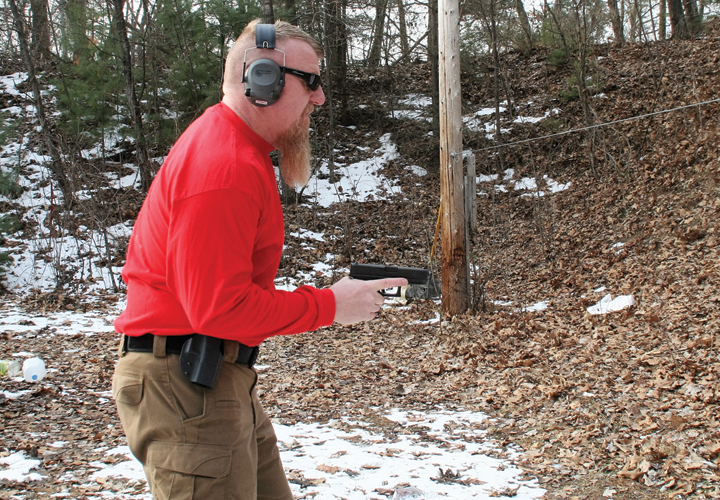 Draw your handgun while raising your elbow up. Once the gun has cleared the holster, drop your elbow straight down into your side, pointing the gun straight ahead at the intended target. Keep your gun and forearm parallel to the ground (Photo: Michael T. Rayburn)
