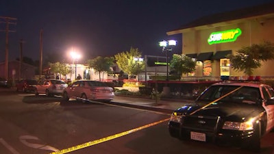 The scene outside the Subway where an officer shot a suspect holding two female employees at knifepoint. (Photo: KTLA screen shot)