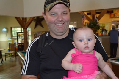 Fort Worth, TX, officer Matt Pearce was shot multiple times on March 15 and critically wounded. Photo shows him before shooting with his baby daughter. (Photo: GoFundMe)