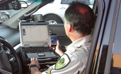 Officer using cellphone forensics tool. (Photo: Cellebrite)