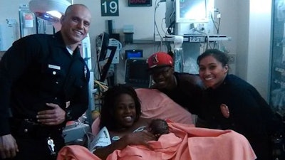 LAPD Officers Maraea Toomalatai and Bryan Armendariz escorted Sasha Murphy and her new-born baby to the hospital. (Photo: Sasha Murphy)