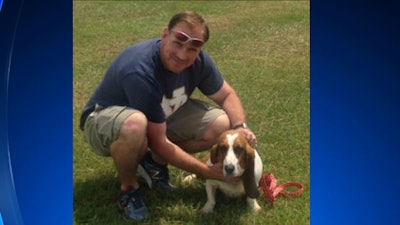 Wall Township Ptl. Frank Kuhl drove Bella the bassett hound from Monmouth County, NJ, to Myrtle Beach, SC, to reunited her with her owner. (Photo: Wall Township PD)