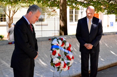 NLEOMF Board Officers Jon Adler and Ken Hartwick placed a special 9/11 Memorial wreath at the section of the Memorial Wall where all the 9/11 heroes' names are inscribed. (Photo: NLEOMF)