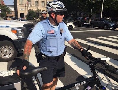 This photo of a Philly officer with controversial tattoos that some say have Nazi symbolism on his left forearm was circulated on Twitter. (Photo: Twitter)