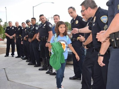 Vanessa Vega, 8, was escorted to school Monday by her fallen father's comrades. (Photo: Palm Springs PD)