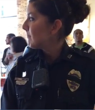 A Cedar Rapid, IA, officer was taunted and haranged by a woman who live-streamed their encounter in a local cafe. (Photo: Screen shot from live-stream video)