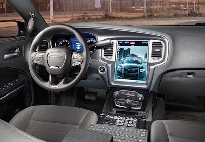 The UConnect touch screen display is mounted in the dashboard of a Dodge Charger Pursuit.