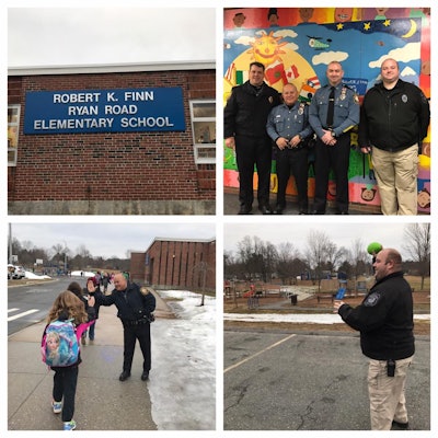 Officers of the Northampton (MA) Police Department greet students arriving at school. They got the idea from a presentation at IACP, but have now ended the practice over concerns it might make some children uncomfortable. (Photo: Northampton PD/Facebook