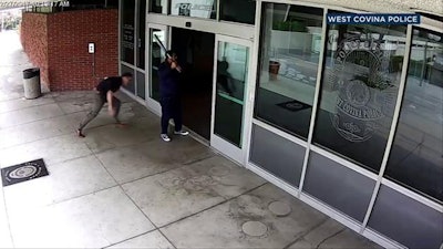 Surveillance image shows a man with a bat outside the West Covina, CA, police station. (Photo: West Covina PD)