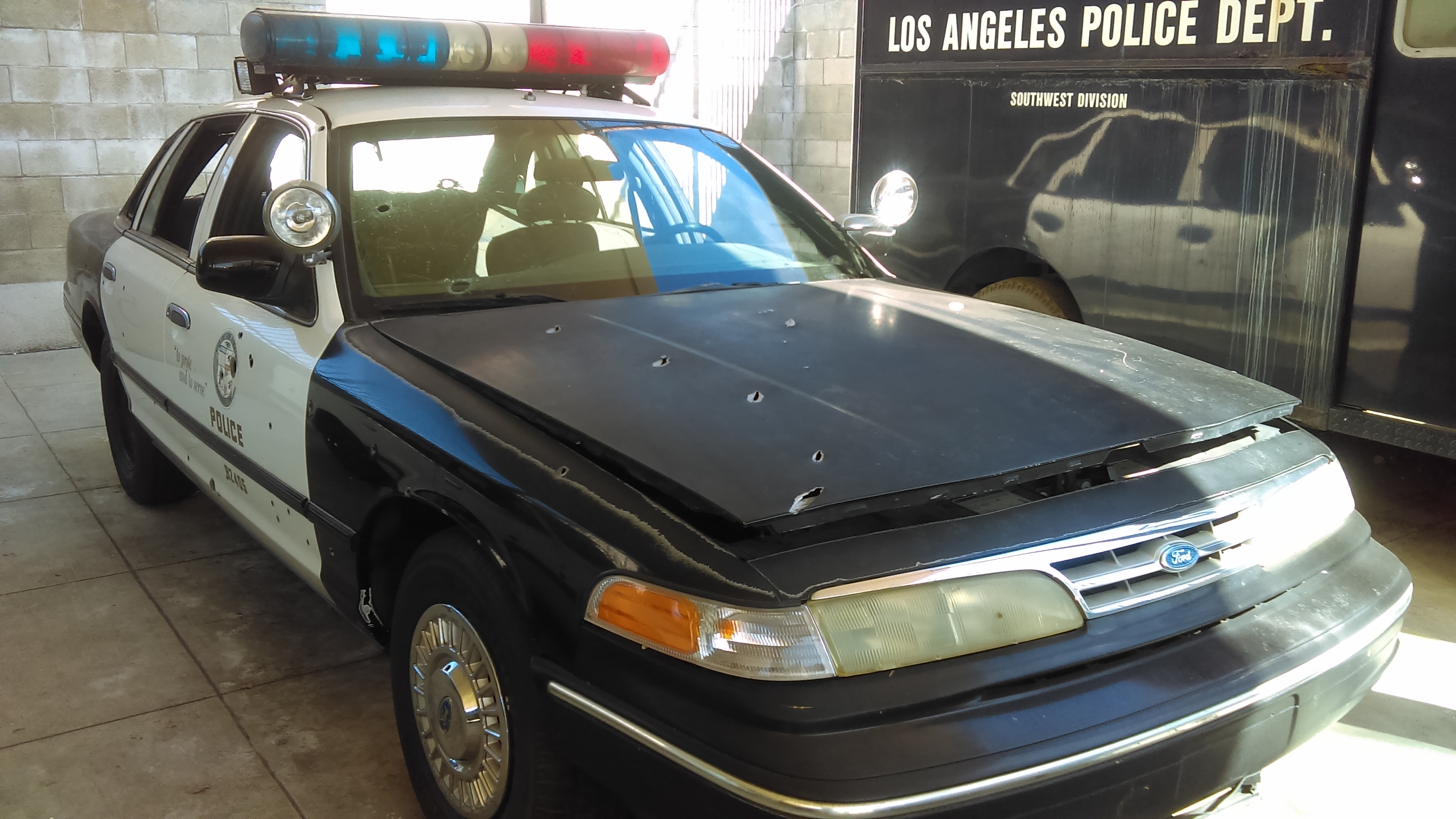LAPD patrol car with battle damage from the North Hollywood Shootout. Photo: Los Angeles Police Museum/David Fryar