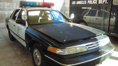 LAPD patrol car with battle damage from the North Hollywood Shootout. Photo: Los Angeles Police Museum/David Fryar