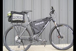 Volcanic Bikes Frame Bag The triangle-shaped Frame Bag from Volcanic Bikes can be used as extra storage for carrying supplies when the rear bag on your bicycle is full. Loading the weight of supplies in the Frame Bag can provide better balance, as the center of gravity is lowered. The bag is reinforced with heavy-duty Velcro, water-resistant materials, and waterproof zipper, and features an exit port in the main compartment for a hydration tube or battery wire. It comes in sizes ranging from small to extra large. www.volcanicbikes.com