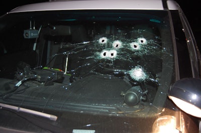 The suspect's shots narrowly missed the officer inside the car. (Photo: Sunset Hills Police Department)