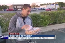 Fugitive Michael Zaydel surrendered to Redford, MI, police and gave them a dozen doughnuts after losing a Facebook bet. (Photo: WXYZ Screen Shot)