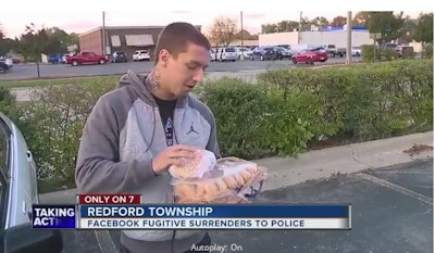 Fugitive Michael Zaydel surrendered to Redford, MI, police and gave them a dozen doughnuts after losing a Facebook bet. (Photo: WXYZ Screen Shot)