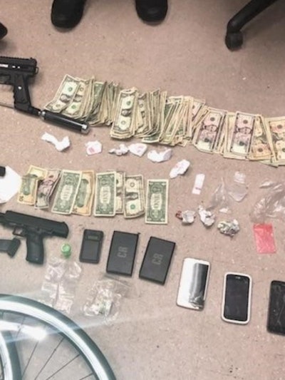 Some of the weapons, drugs, and cash New Jersey authorities recovered while investigating a threat against an Asbury Park police officer. (Photo: Asbury Park PD)