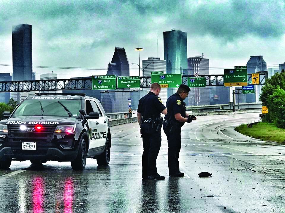 To maintain both officer and citizen safety as much as possible, Houston officers were working in a minimum of two-person teams in 'cage cars' so they would have enough people on hand to help anyone they encountered as well as handle any other situations that might occur. Photo: Houston PD/Flickr