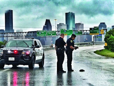To maintain both officer and citizen safety as much as possible, Houston officers were working in a minimum of two-person teams in 'cage cars' so they would have enough people on hand to help anyone they encountered as well as handle any other situations that might occur. Photo: Houston PD/Flickr