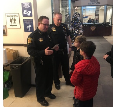 The two boys came to the Douglas County (CO) Sheriff's Office to donate their allowances to the family of a fallen deputy. (Photo: DCSO/Twitter)