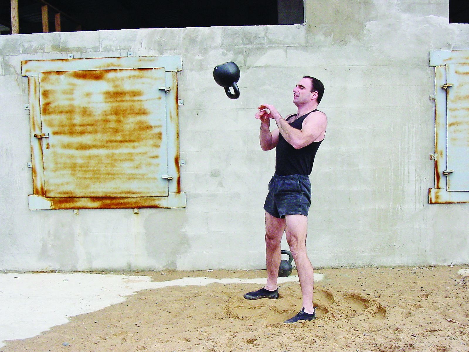 Jeff Martone of Tactical Athlete performs high-intensity kettlebell swing and catch exercises. Photo: Jeff Martone