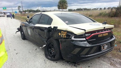 A speeding sedan slammed into this Florida Highway Patrol car, reportedly on purpose.