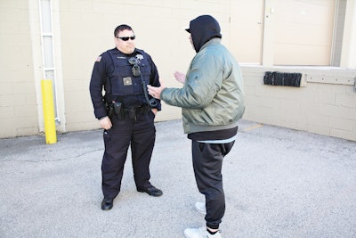 Standing with your thumbs inside your pockets or your hands grabbing your vest during a contact doesn't come across as professional and doesn't give you a position of advantage. Photo: Dave Young