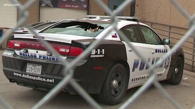 The windows of this Dallas police vehicle were smashed over the weekend. (Photo:WFAA)