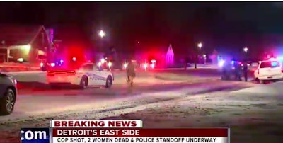 A Detroit police officer was shot in the leg Sunday night. Monday morning police were in a standoff with two gunmen in neighboring houses. (Photo: WXYZ)
