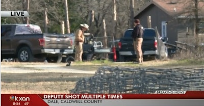 Investigators at the scene where a Caldwell County (TX) Sheriff's deputy was shot multiple times Friday night. (Photo: KXAN screen shot)