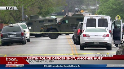 One police officer was shot and a second was hurt while running for safety after a gunman fired at them from inside a southeast Austin, TX, home Sunday night. Photo: KXAN screenshot