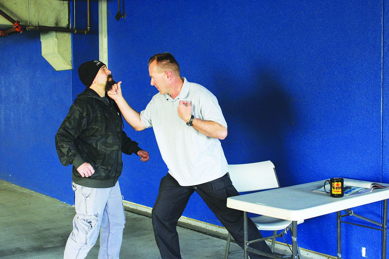 The Wolverine punch can be executed easily as you arise from a seated position. This is much better than waiting to stand up and then punching your attacker. (Photo: Al Abidin)