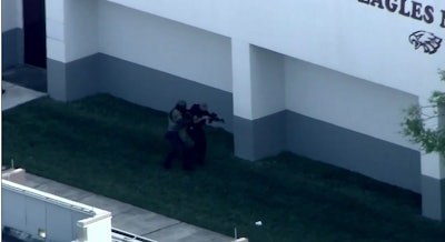 Police officers make entry into Parkland's Marjorie Stoneman Douglas High School during the Feb. 14 shooting.