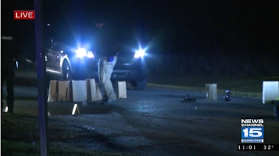 Emergency vehicles at the site of a traffic stop shooting in Garrett, IN, Tuesday night.