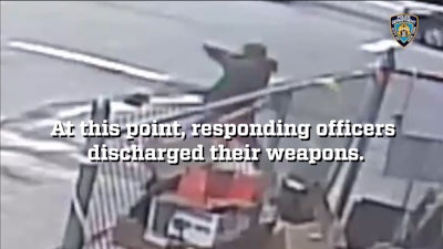 Image from surveillance video shows Saheed Vassell assuming what appears to be a shooting stance while pointing a pipe. Police called to the scene by at least three 911 calls about a man brandishing a gun shot and killed Vassell.