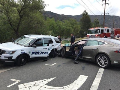 The Tesla sedan veered and struck the police SUV. Photo: Laguna Beach PD PIO/Twitter