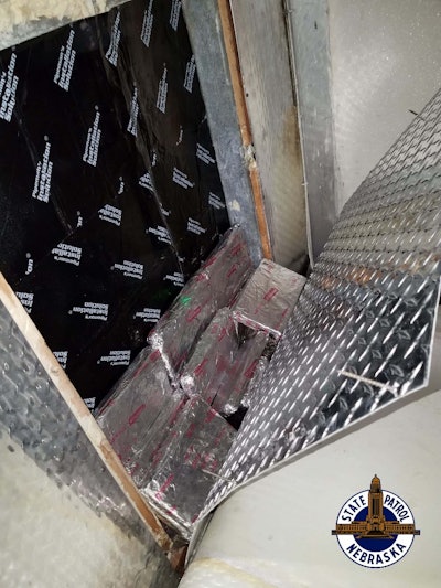 Nebraska State Patrol troopers searched the vehicle and discovered a false compartment located in the empty trailer. The compartment contained 42 foil-wrapped packages of cocaine and a powder suspected to be fentanyl. (Photo: NSP)