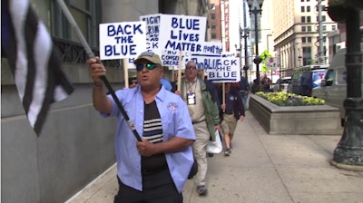 Chicago FOP members protest the suspension of Officer Robert Rialmo.