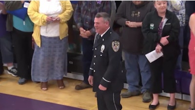 Dixon, IL, school resource officer Mark Dallas received a standing ovation as he led Dixon High School's Class of 2018 into the graduation ceremony Sunday. Last week he saved them from a mass shooting.