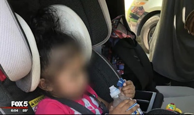 Cpl. Darryl Wormuth of the Prince George's County (MD) Police Department rescued this toddler from a hot car in a parking lot where her father was arrested.