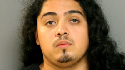 Ernesto Godinez, a reputed Almighty Saints gang member, is charged with attacking an ATF agent with a deadly weapon. (Photo: Chicago PD)