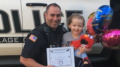 After gifting her doll to a Blasdell (NY) PD officer, Gabby now has Elmo back in her room and she says she wants to be a police officer when she grows up. (Photo: Blasdell PD)