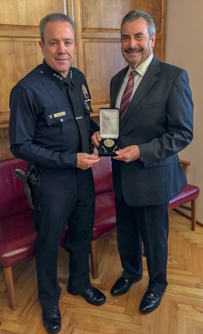 Michel Moore has been sworn in as the new chief of the LAPD. Here he is seen with outgoing chief Charlie Beck. Photo: LAPD Chief Michel Moore/Twitter