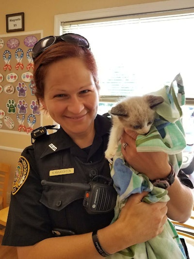 Officer Heather McNaughton helped a family pick up its kitten from the vet. Photo: Duluth PD/Facebook