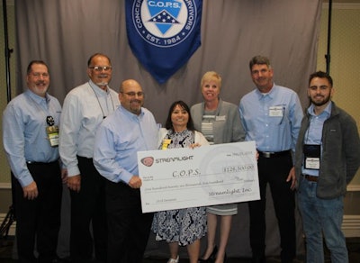 Streamlight representatives present a check for $126,500 to Concerns of Police Survivors (C.O.P.S.) National President Cheryl Schultz and Executive Director Dianne Bernhard at National Police Week 2018. (Photo: Streamlight)