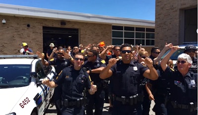 Screen grab of Norfolk (VA) police officers, dispatchers, call takers, and firefighters responding to the 'lip-sync challenge' on Facebook.