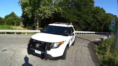 A Missouri police officer has been suspended after a 'distracted driving' collision with a bicyclist. Photo: KMBC-TV screenshot