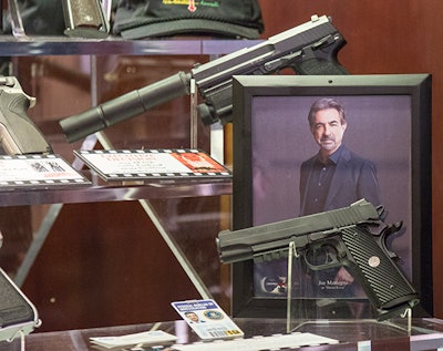 Actor Joe Mantegna of Criminal Minds and Gun Stories SIG SAUER 1911 TACOPS Pistol placed into the NRA Museum’s Hollywood Gun Exhibit. Photo: Forrest MacCormack, NRA Staff