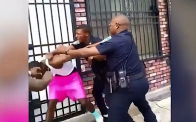 Screen grab of a widely circulated video showed Officer Arthur Williams repeatedly striking 26-year-old Dashawn McGrier with his fists and knee and taking him to the ground in front of an East Baltimore rowhouse.